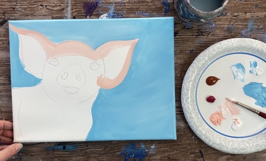 Paint the ears of the pig painting. 